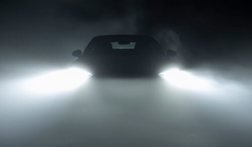 Car in the dark with fog and headlights on