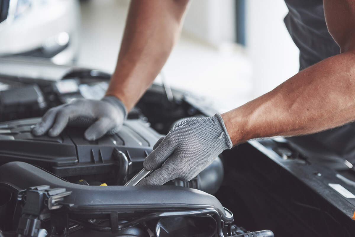 auto mechanic working in garage repair service California